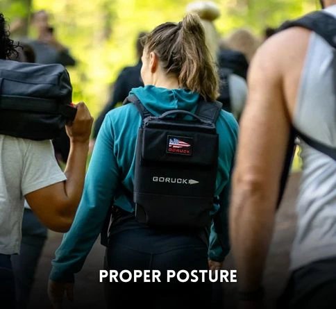 Rucking for Women: Benefits, Tips, and Training Guide demonstrating proper rucking form female with posture and core engagement