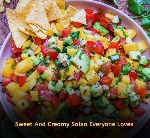 Fresh mango avocado salsa with cilantro, lime, and red onion served in a bowl