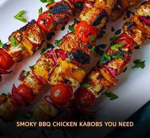 BBQ chicken kabobs brushed with sauce while grilling over open flame