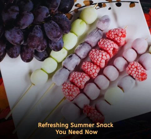 Frozen fruit skewers with grapes berries kiwi and melon for healthy summer snacking