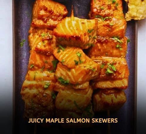Maple glazed salmon kabobs grilling with caramelized edges and smoky flavor