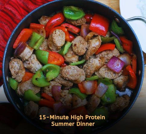 Turkey sausage skillet with colorful peppers and onions in a cast iron pan