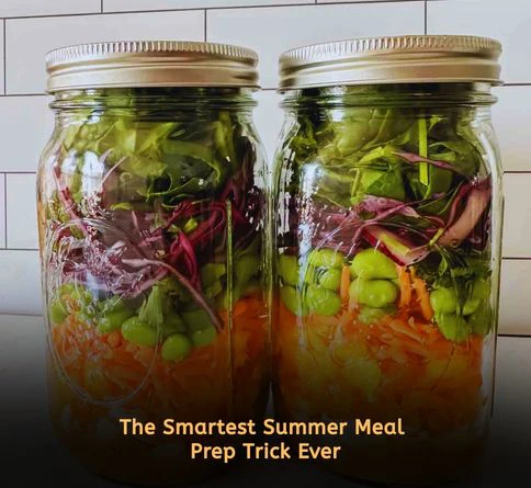 Healthy mason jar salads layered with chickpeas carrots greens and dressing for easy summer meal prep lunches