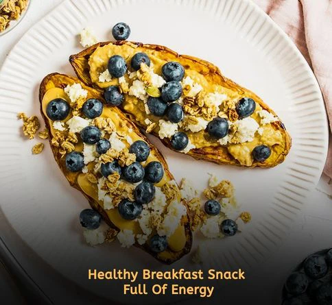 Toasted sweet potato slices topped with peanut butter and berries for a healthy snack recipe