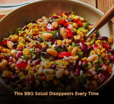 Cold corn and black bean salad with tomatoes and lime dressing in a colorful bowl