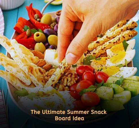 Greek mezze board with hummus pita olives cucumber and grilled halloumi cheese