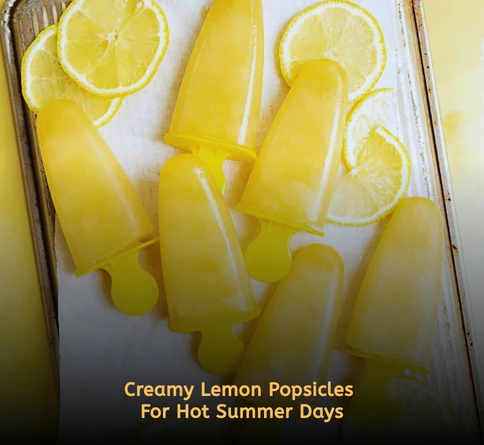 Creamy lemonade popsicles in molds with fresh lemon slices and yogurt texture visible