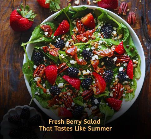 Summer berry spinach salad with strawberries blueberries pecans and poppyseed dressing