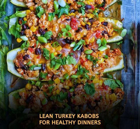 Turkey and zucchini kabobs grilling with light seasoning and smoky char