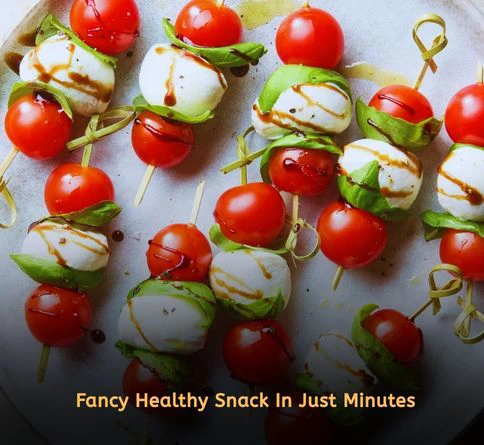 Cherry tomato and mozzarella skewers drizzled with balsamic glaze for a healthy appetizer snack