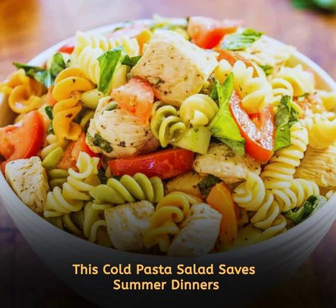 Cold chicken pasta salad with peas, carrots, and Italian dressing served chilled