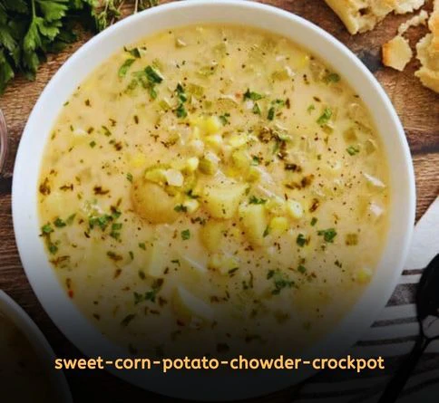 Creamy sweet corn and potato chowder in a crockpot topped with fresh herbs and summer corn kernels.