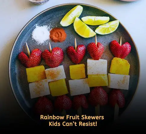 Colorful fruit skewers with grapes, strawberries, and melon for kids picnic snack.