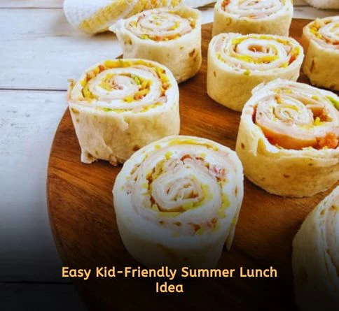 Turkey and hummus pinwheel wraps sliced into bite-sized pieces on a serving tray