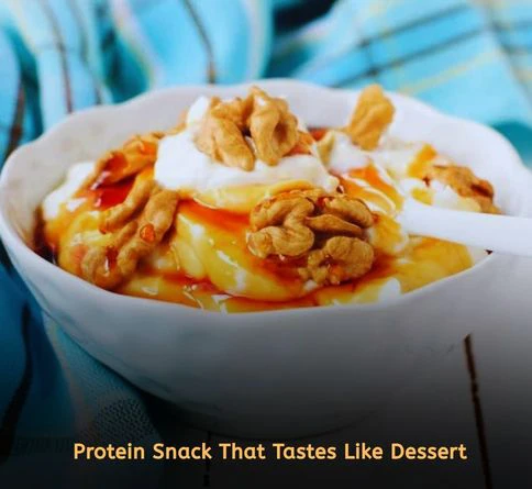 Greek yogurt topped with honey and crushed walnuts in a ceramic bowl for a healthy high protein snack