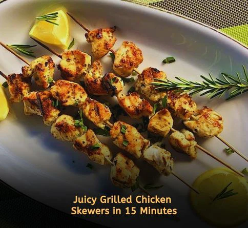 Lemon herb grilled chicken skewers with onions served on a summer dinner plate
