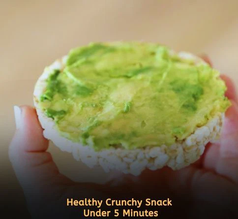Brown rice cakes topped with mashed avocado and chili flakes for a healthy savory snack recipe