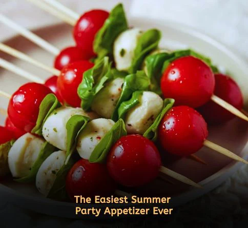 Caprese skewers with cherry tomatoes, mozzarella balls, basil, and balsamic glaze on toothpicks