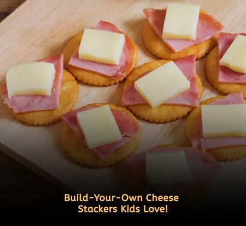 Cheese and crackers stacked together for interactive kids picnic snack.