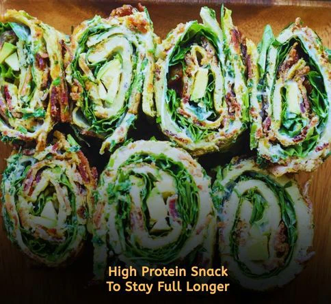 Spinach roll-ups filled with sliced hard boiled eggs for a healthy protein packed snack