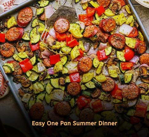Sheet pan sausage with bell peppers zucchini and onions baked as a quick summer dinner recipe