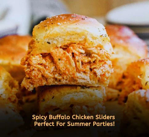 Buffalo chicken sliders made in a crockpot topped with ranch dressing on soft slider buns.