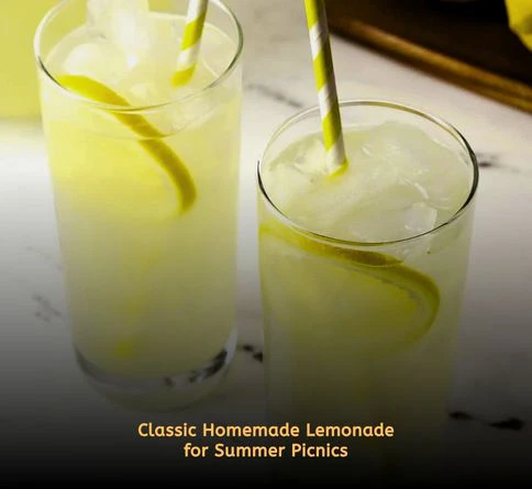 Pitcher of fresh squeezed lemonade with lemon slices and ice on a picnic table