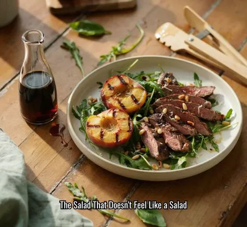 Grilled steak and arugula salad with fresh peaches for summer dinner.