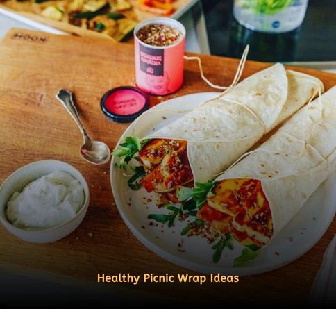Roasted vegetable wraps filled with hummus and colorful vegetables.