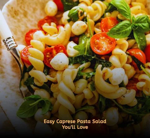 Caprese pasta salad with mozzarella tomatoes and basil served outdoors