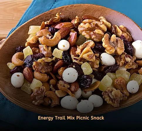 Mixed nuts and dried berries in small container for picnic