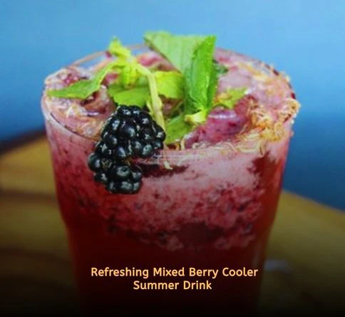 Berry cooler drink with blueberries raspberries and ginger ale