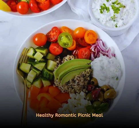 Mediterranean quinoa bowl with cucumbers, olives, tomatoes, and lemon dressing.