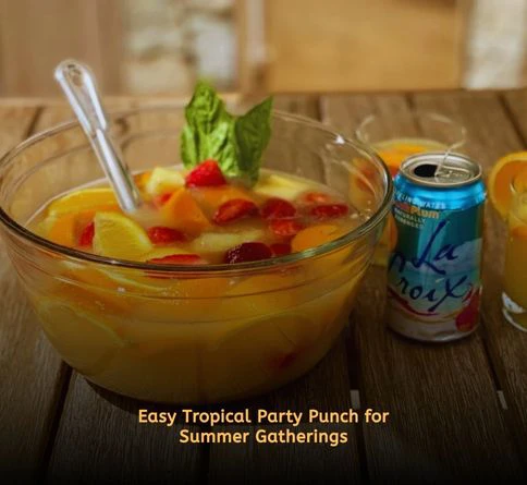 Large bowl of tropical fruit punch with orange pineapple and berries