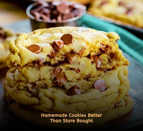 Soft chocolate chip cookies stacked in a picnic basket outdoors