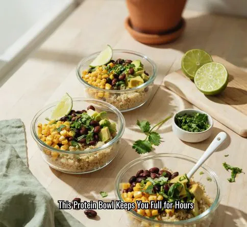 Corn and black bean quinoa bowl with avocado and lime.
