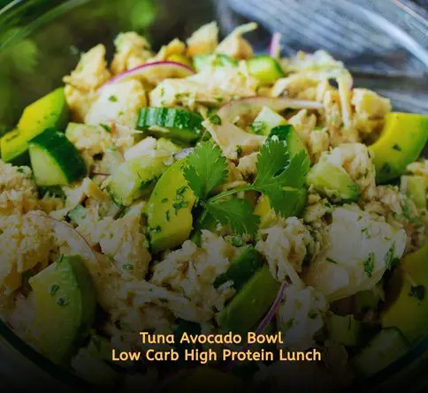 Tuna salad served inside avocado halves for a healthy summer meal.