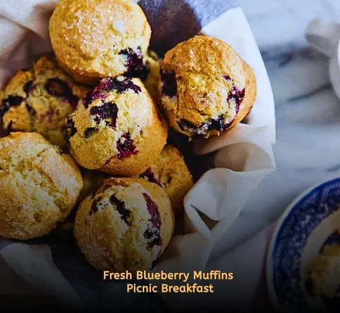 Homemade blueberry muffins in picnic basket