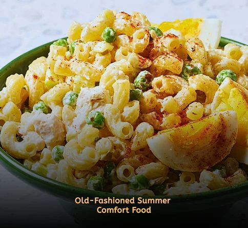 Cold tuna macaroni salad with celery and creamy dressing served in bowls.