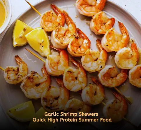 Juicy garlic butter shrimp skewers grilled for a low calorie high protein summer meal.