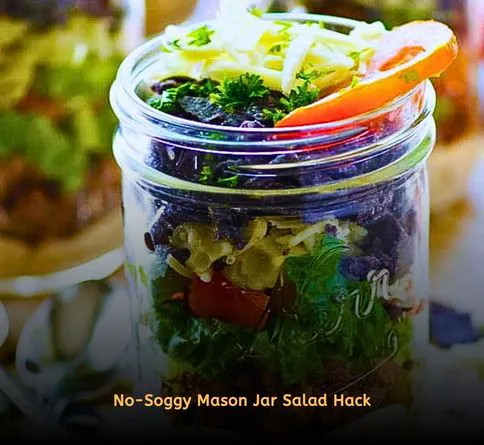 Colorful layered salad in mason jar for picnic lunch