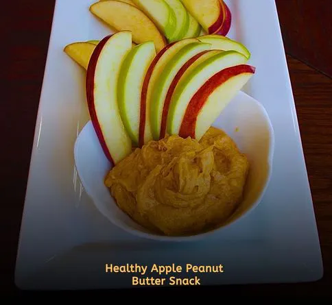 Apple slices dipped in peanut butter picnic snack