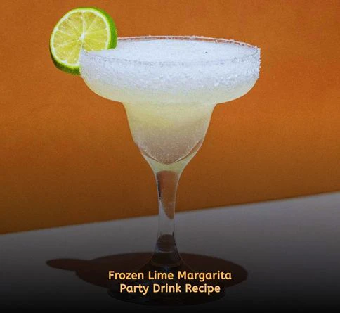 Frozen lime margarita in salt-rim glass with lime wedge and ice