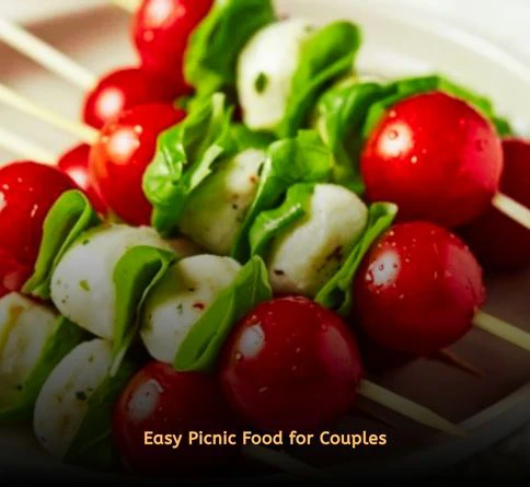 Caprese skewers with cherry tomatoes, mozzarella, basil, and balsamic glaze.