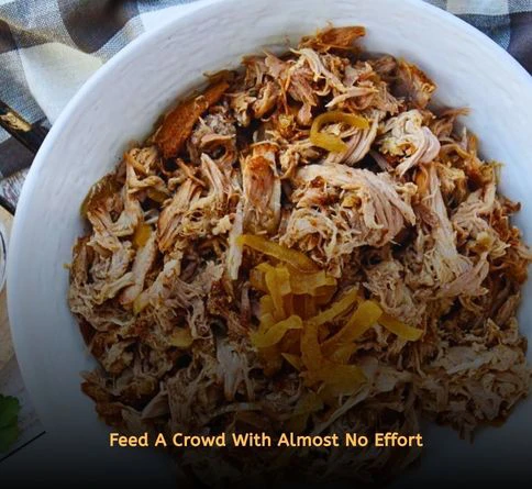 Slow cooker pulled pork piled onto burger buns for an easy summer gathering meal.