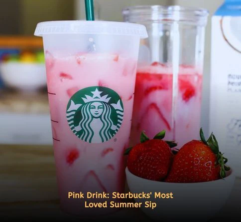 Pink Drink made with strawberry acai refresher, coconut milk, freeze-dried strawberries, and ice in a clear cup