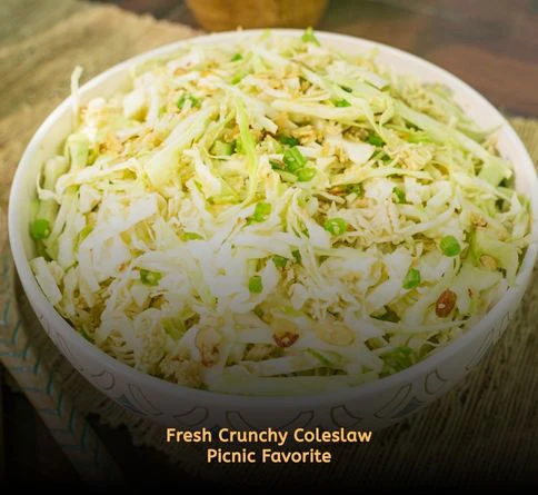 Fresh homemade coleslaw with shredded cabbage and carrots in a picnic bowl