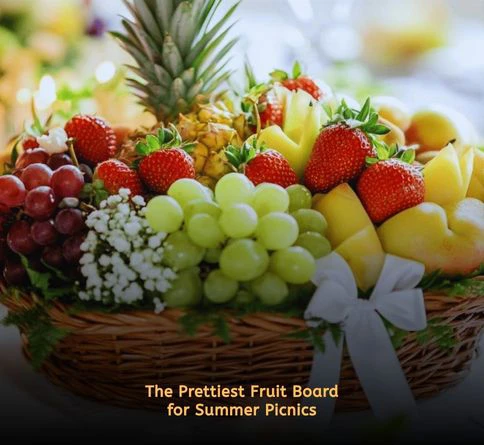 Seasonal fruit platter with strawberries, peaches, grapes, and colorful arrangements for an outdoor picnic.