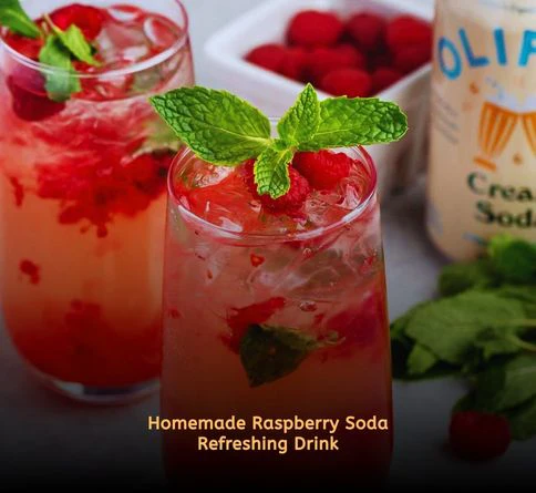 Sparkling raspberry soda with ice and fresh raspberries