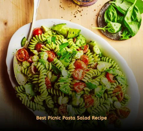 Pesto pasta salad with sun-dried tomatoes, parmesan, and pine nuts.